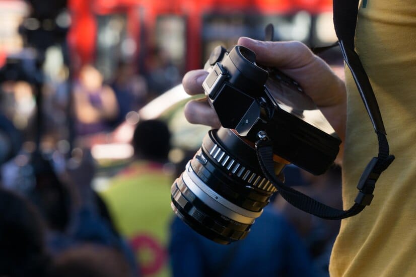 midsection-man-holding-camera_1048944-23600276